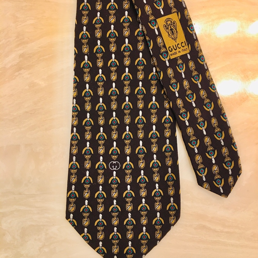 Gucci tie at price listed  get Gucci logo 4 free.